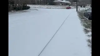 A car makes its way down 12th Street Drive NW in Hickory Sunday morning