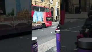 Topview Sightseeing open top Enviro 400 SN12EGY passes through Tooley Street on the Red Tour route