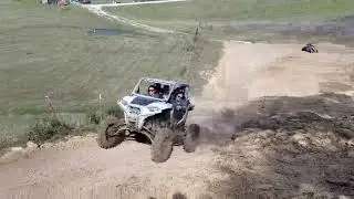 Lifted RZR on 4in Portals and 33in BKT hill climb at Rocky Ridge