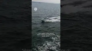 Moottorivene leikki vaarallisesti laivan per&auml;ss&auml;