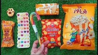 🟧 Satisfying video Orange ASMR lollipops candy and Giant Popcorn eating video ASMR opening candy
