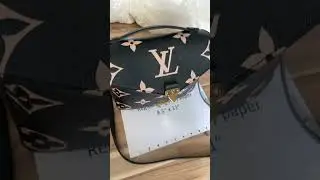 Pochette M&eacute;tis black and beige M45773