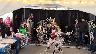 Canadian first nation people cultural performance and snow sculpture in town