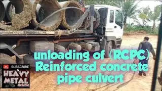 excavator , unloading of (RCPC) Reinforced concrete pipe culvert, heavy metal operator