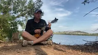 Playing mandolin at a park in Ireland