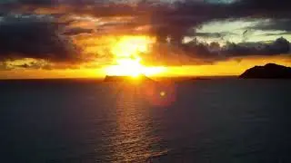 Golden Hour on Sherwoods Beach: Witnessing a Breathtaking Sunrise in Oahu, Hawaii.
