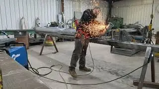 Welding up a sheet metal pipe taper.