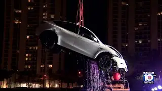 Couple rescued after Tesla crashes into Sunny Isles Beach canal