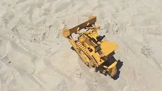 At The beach playing with a RC 4 wd eagle machinery dozer
