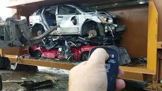 Big mac car crusher @ AA Auto Salvage & Recycling LLC with remote