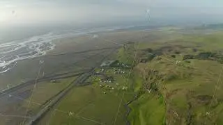Aerial panoramic view of flat landscape with cliff and elevated plateau. Wide river, road and