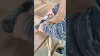 making round holes in a wooden furniture frame using a power drill and a circular hole saw cutter