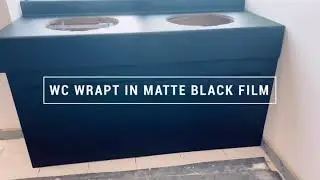 Office toilets vinyl wrapped in matte black film