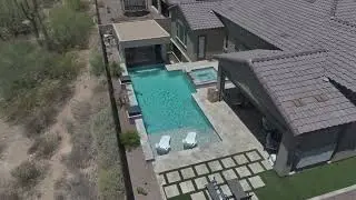 Dove Mountain pool with a sunken Kitchen and Water features
