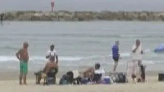 Beachgoers in Tel Aviv enjoy sun on polling day