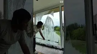 Squeegee sweeps, morning foam clears glass to reveal bright tropical stillness