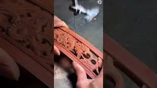 Scroll saw carves floral pattern into reddish wood