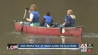People Pick up Trash Along The Blue River