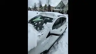 Cleaning car in the Snow