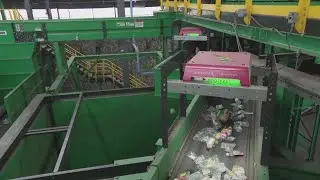 AI being used by recycling plant to sort through glass, paper and plastic