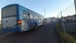 A bus driver uses wrong lane and throws water on a biker