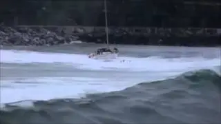 Yacht capsized by breaking wave