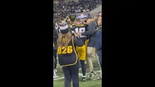 Drew Stevens and LeVar Woods celebrate after the Hawkeyes' win