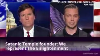 Tucker Carlson interviews a Satanist - and he looks just as you'd imagine