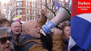 Protesters Gather En Masse In Spain After U.S. Military Actions Against Venezuela