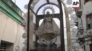Catholics take part in procession to honour Cuba's patron saint, Our Lady of Charity