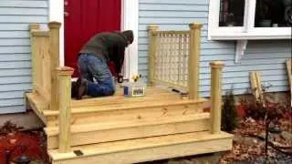 Railings on our first front porch! Work in progress.