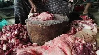 Beef cutting skills by Professional butcher at roadside meat Shop.Big Cow Meat cutting skills