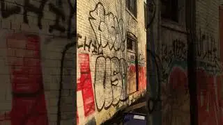 Laneway and graffiti abandoned factory toronto february 7, 2023
