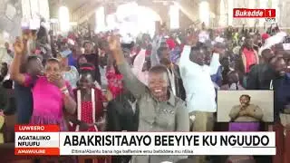 BAAGALA ATUUZIBWE KU BULABIRIZI, ABAKRISITAAYO BEEYIYE KU NGUUDO, BAWAKANYA OKUSUULA REV. KASANA