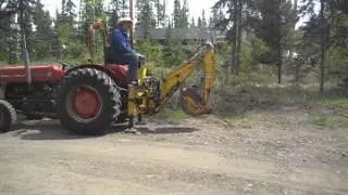 MF135 with D-100 backhoe