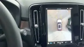 Volvo's updated 360° surround view camera in a parking lot at parking lot speeds