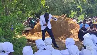 Rev. Alexander Kambiri preaching at the funeral service in Malomo- Ntchisi