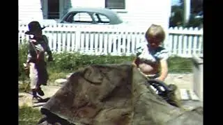Children playing cowboys and Indians in yard under construction.  Detroit 1950