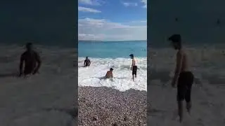 swimming in the beach.. Amputee guys swimming.