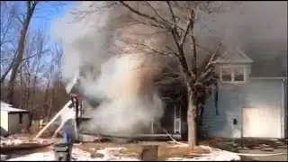 Eyewitness video shows crews battling a house fire in Manchester