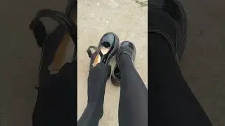 Girl take her black shoes off
