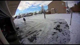 Woman Slips on Black Ice in Front of Garage || ViralHog