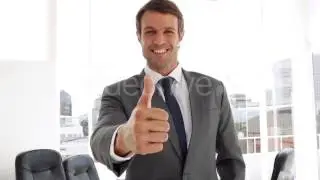 Stock Footage - Happy Businessman Giving Thumbs Up | VideoHive