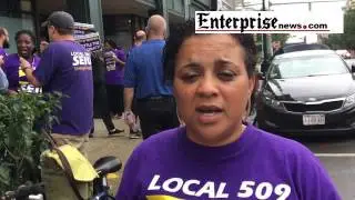 More than two dozen people picketed Friday outside Old Colony Elder Services in Brockton, on July 29