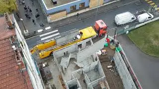 GRUTIER / GRUE À TOUR /Déchargement et pause de prémurs .double elingage. + caméra . ( MANITOWOC ) .