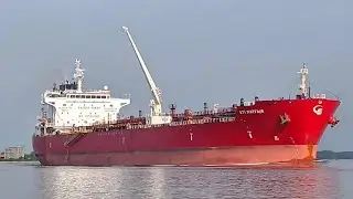 Large oil tankers navigate through the narrow bend.
