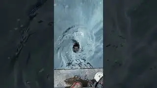 Watch a flooded street drain unleashing a torrent of water after unclogged!