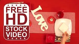 Free Stock Videos &ndash; celebration table setup with red colored plates glasses and decorative elements