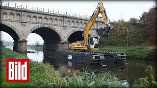 40 Tonnen-Bagger kann schwimmen - Fast wie ein Schaufelrad-Dampfer