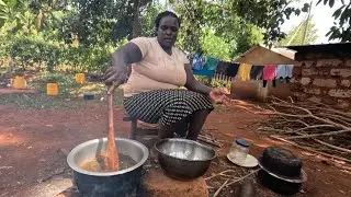 Ultimate feast in the African village kitchen a mum with her kinds enjoying the feast 
